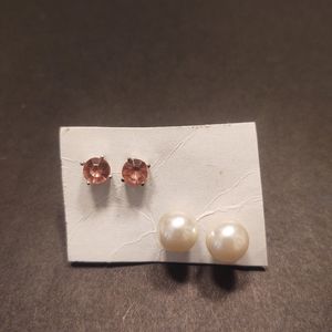 Two pairs of white and pink stud earrings